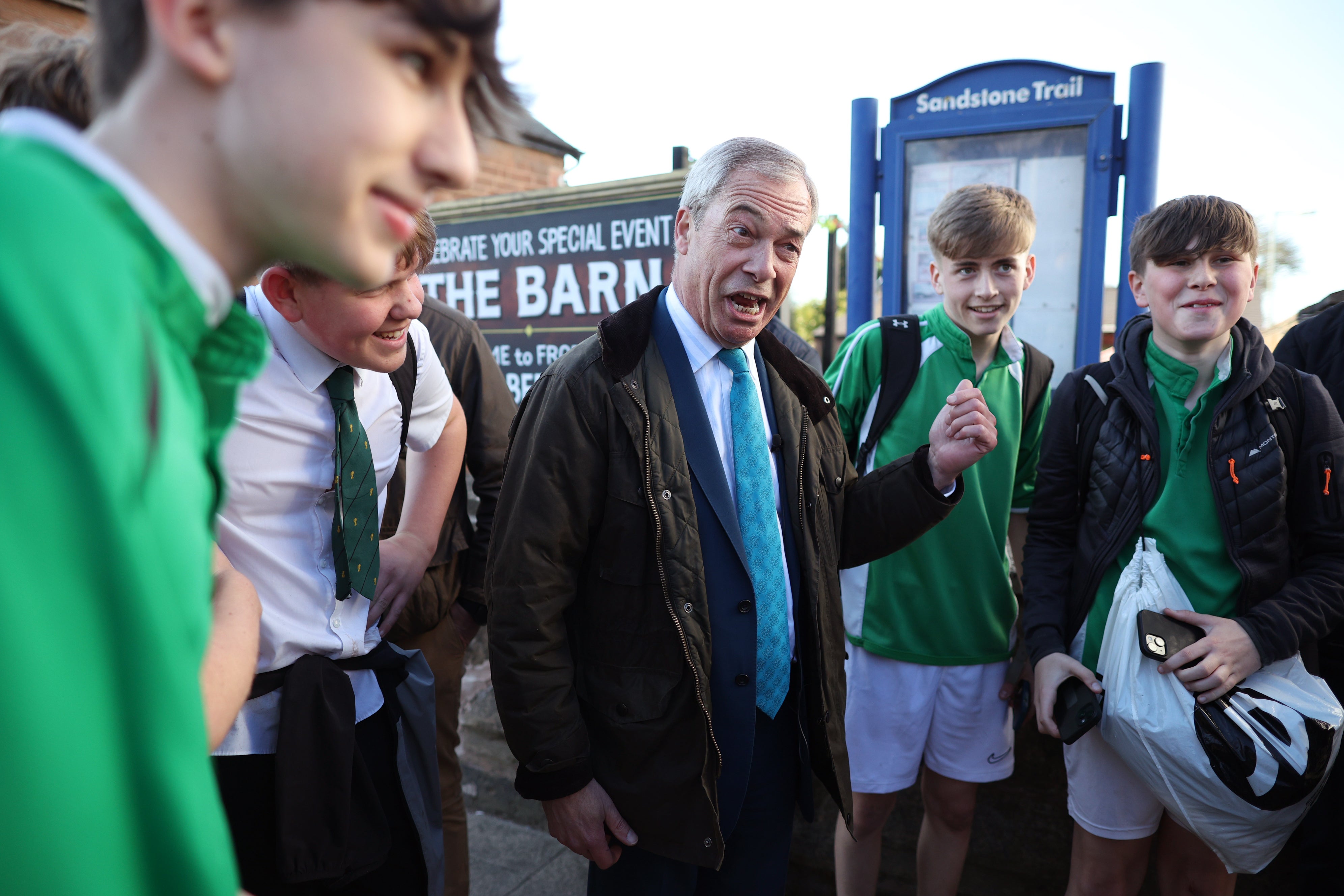 Farage speaks to young boys in Frodsham, England