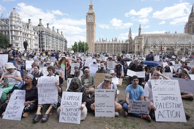 Protesters opposing the banning of Palestine Action take part in a mass action in Parliament Square on August 9 (Stefan Rousseau/PA)