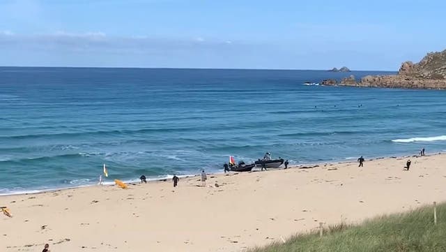 <p>Moment drugs gang chased onto UK beach to shock of sunbathers.</p>