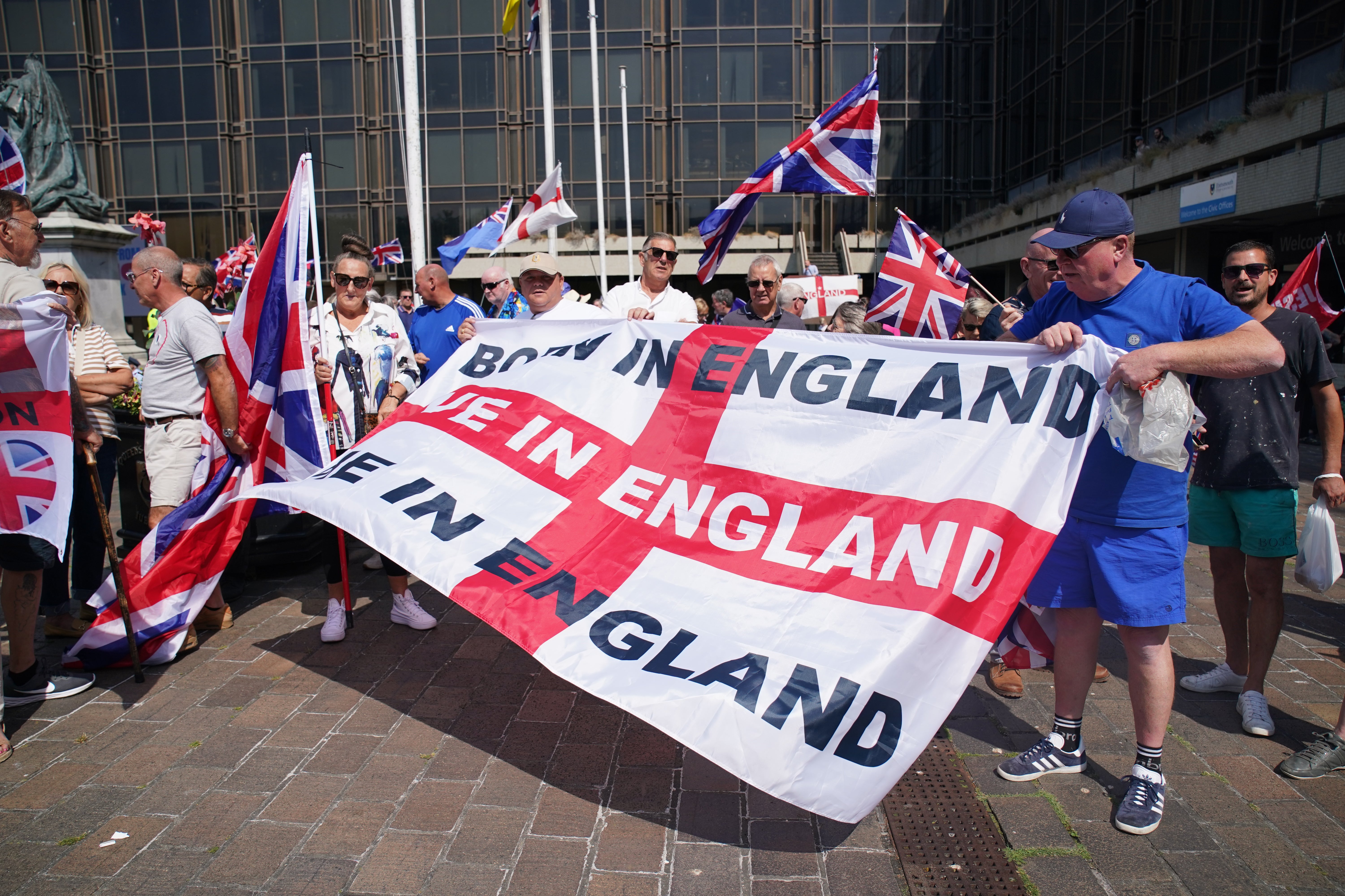 People take part in an anti-migrant Guildhall Square, Portsmouth, on Friday