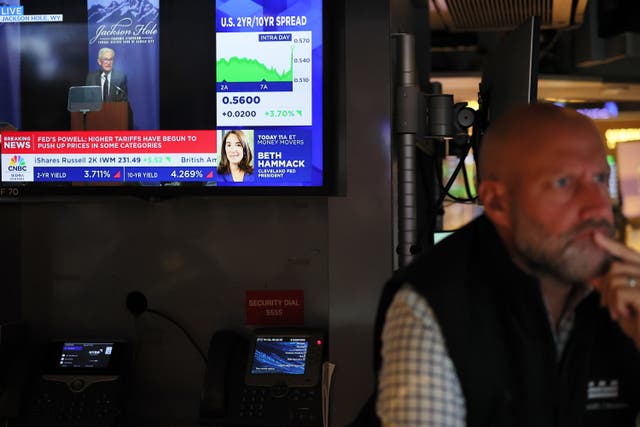 <p>Donald Trump gave a meandering answer when asked about a potential interest rate cut discussed by Fed Chair Jerome Powell earlier in the day. Pictured: A TV at the New York Stock Exchange shows Powell speaking about the potential rate cut. </p>