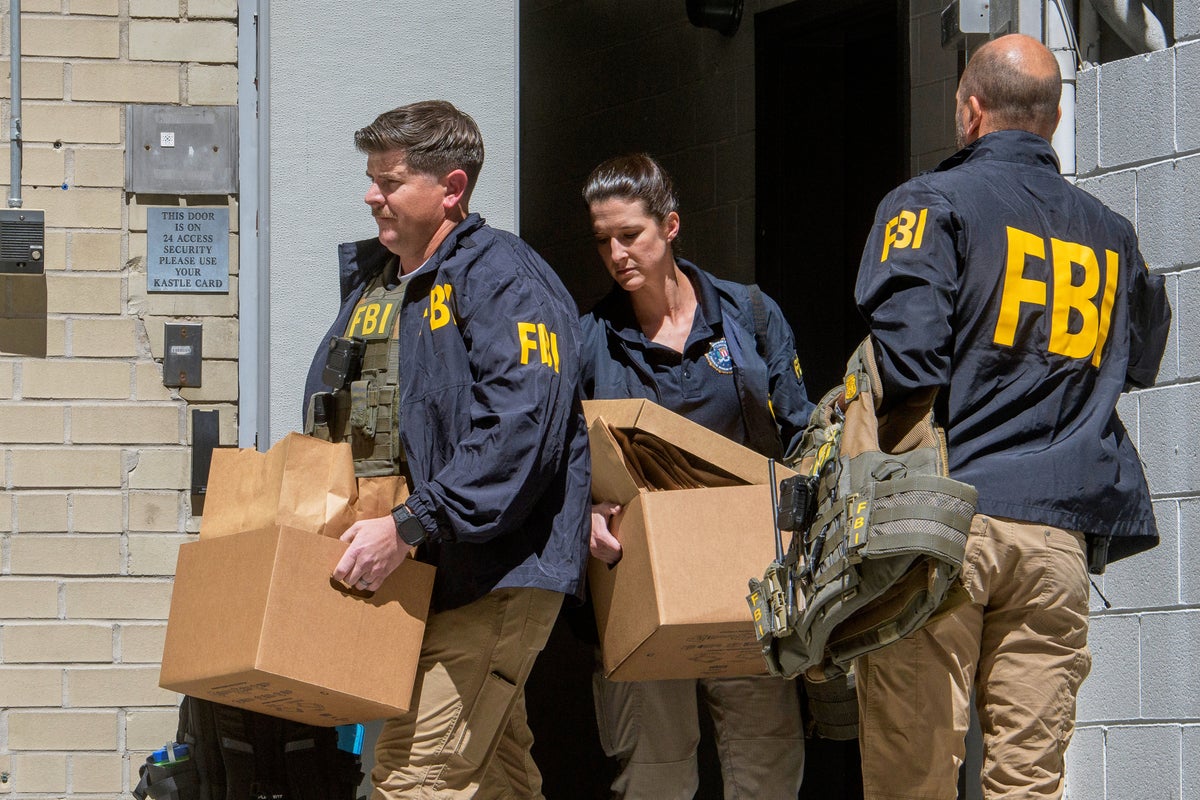Photos of FBI searching the home and office of John Bolton, a former Trump adviser turned critic