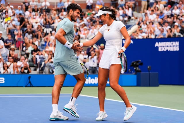Emma Raducanu (right) and Carlos Alcaraz played mixed doubles together (Yuki Iwamura/AP)