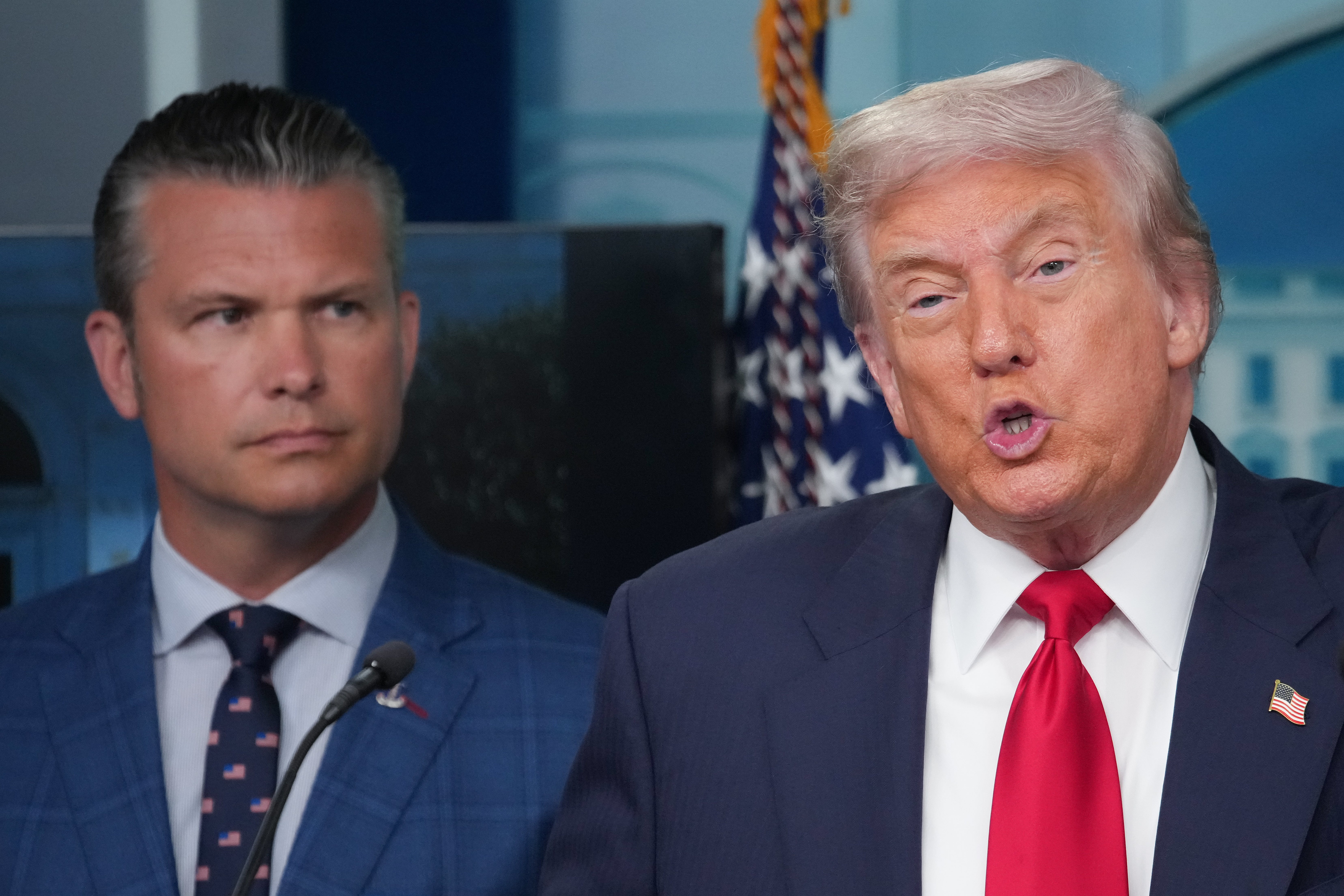 President Donald Trump, right, and Secretary of Defense Pete Hegseth, left, during a press briefing