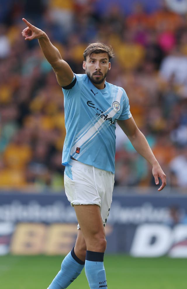 <p>Ruben Dias of Manchester City looks on </p>