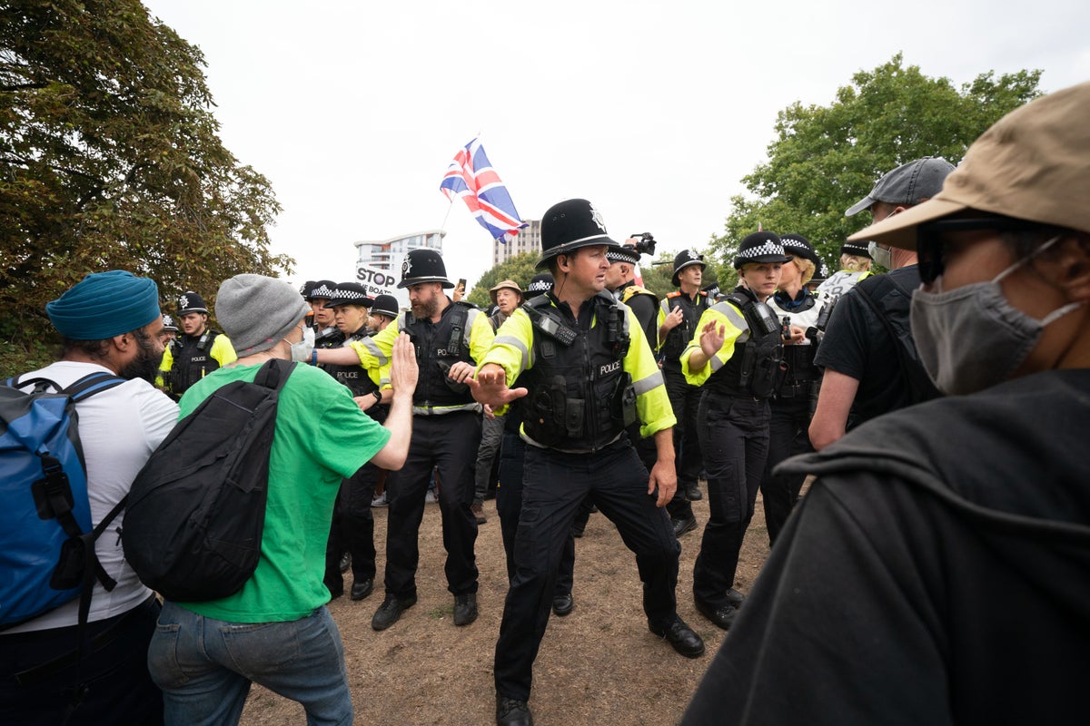 Police clash with protesters outside UK asylum hotels