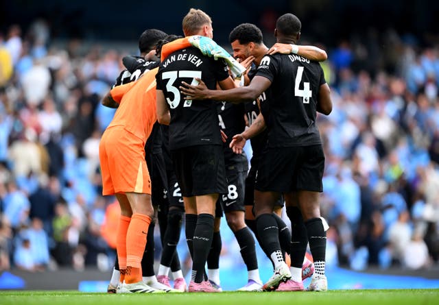 <p>Tottenham's players celebrate their 2-0 win at Manchester City</p>