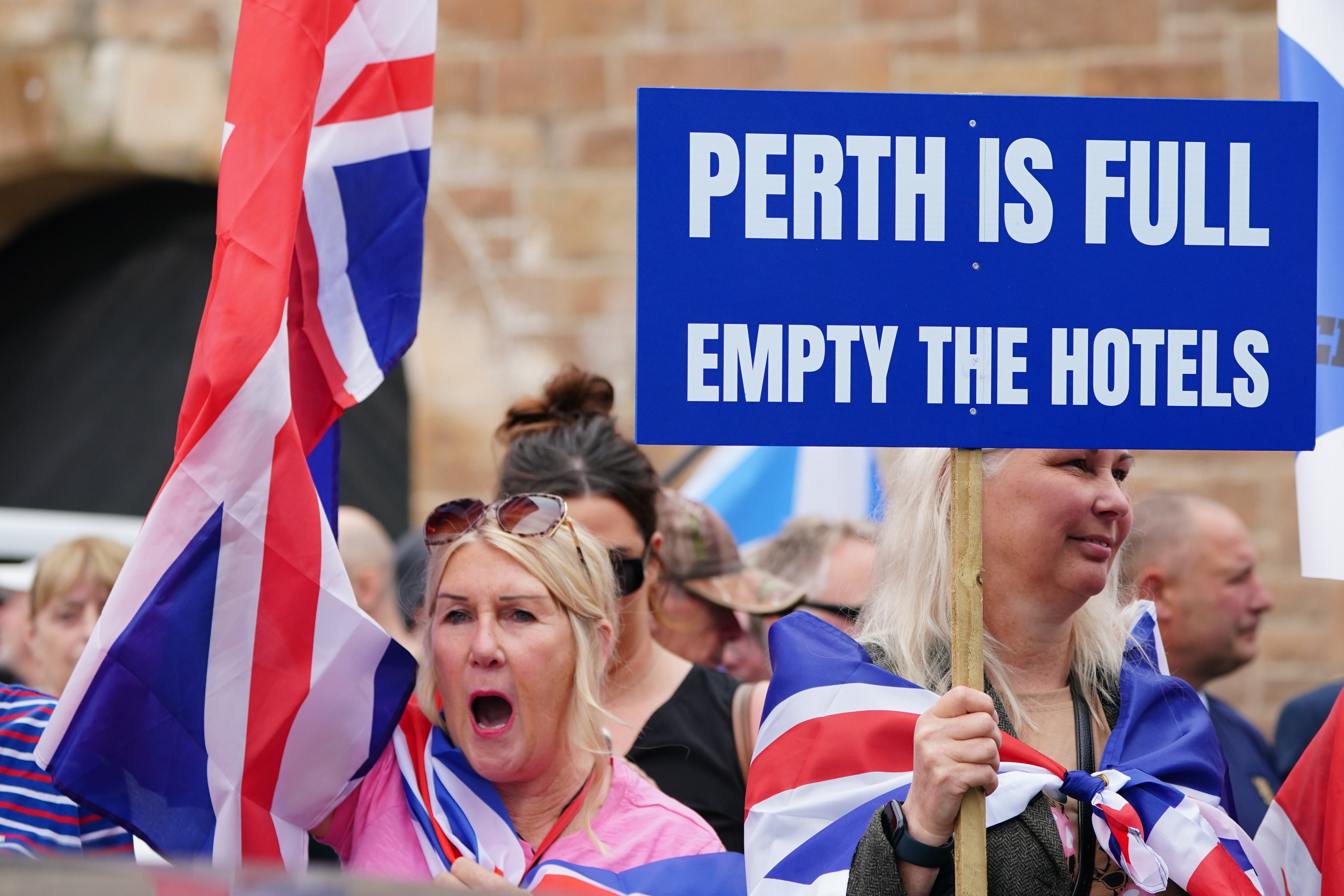 An Abolish Asylum System protest took place outside the Radisson Hotel in Scotland (Jane Barlow/PA)