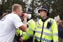 Anti-migrant protesters hurl abuse as rival groups clash in Horley