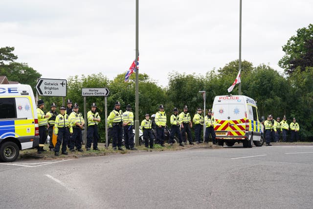 Police at a counter-protest to a Stand Up to Racism rally outside the Four Points By Sheraton hotel in Horley, Surrey (Gareth Fuller/PA)