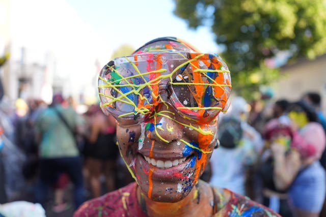 <p>People taking part in J'ouvert ahead of the Children's Day Parade</p>