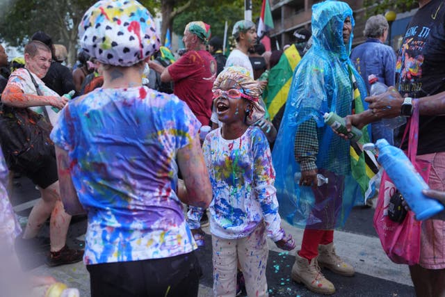 <p>People taking part in J’ouvert ahead of the Children’s Day Parade</p>
