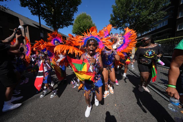 People taking part in the Children’s Day Parade, part of Notting Hill Carnival (Yui Mok/PA)