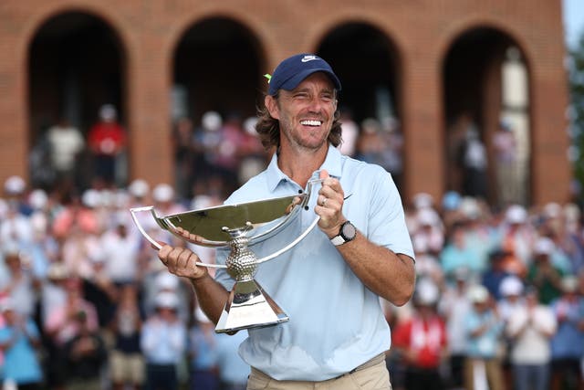 <p>Tommy Fleetwood of England celebrates with the Fedex Cup trophy</p>