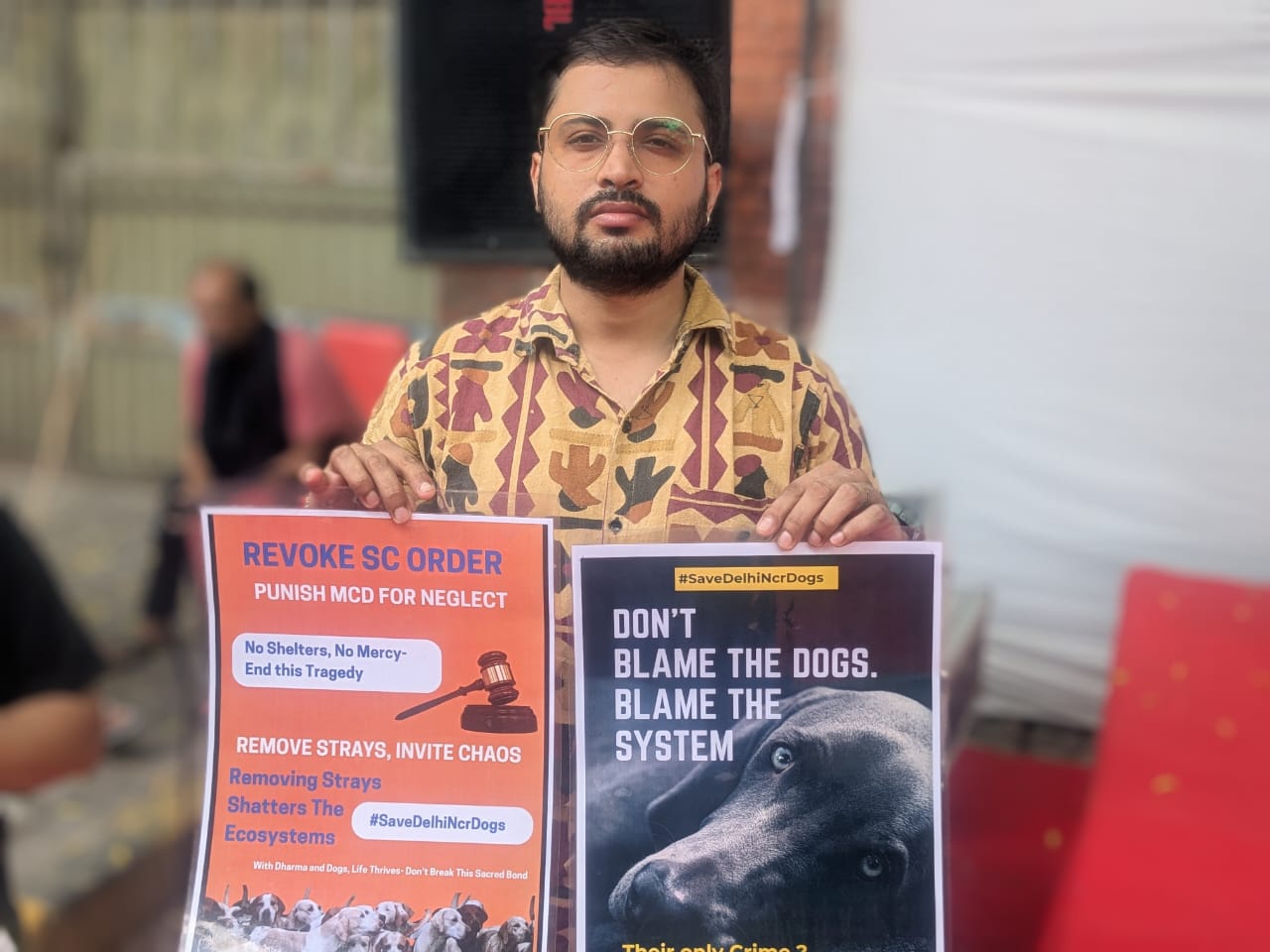 A demonstrator protesting against the Indian Supreme Court order regarding moving the dogs to shelters