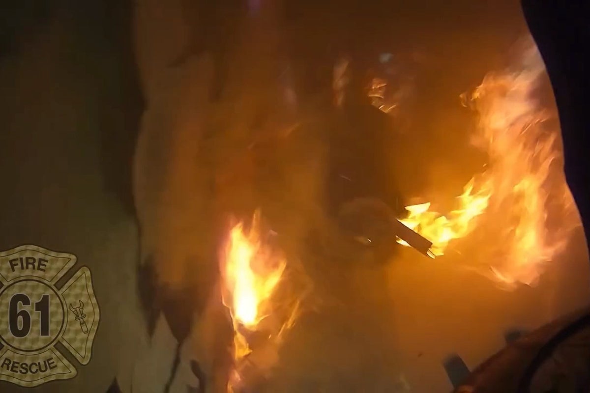 Firefighter falls 13ft through floor of burning building - but survives with no major injuries