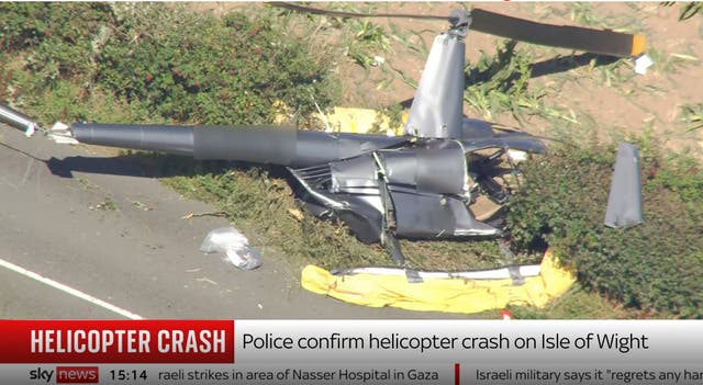<p>Images from Sky News of a helicopter that crashed on the Isle of Wight</p>