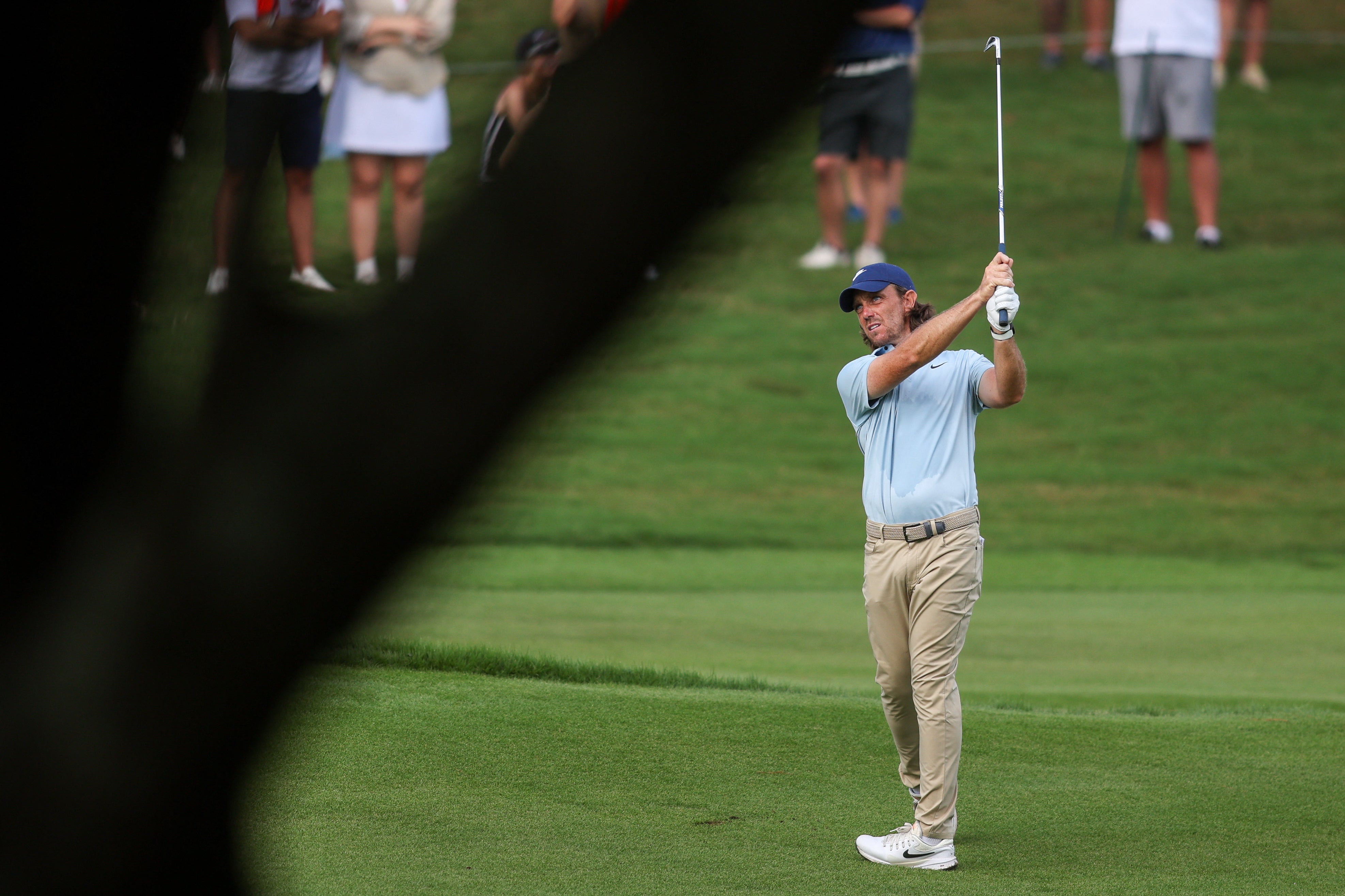 Tommy Fleetwood plays his shot on the 16th hole