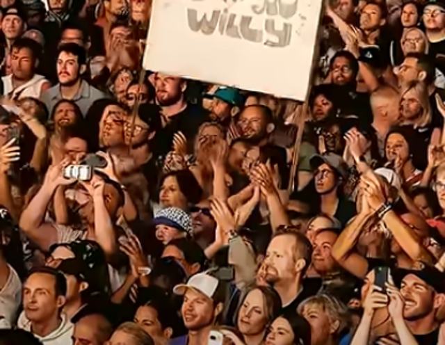 <p>A screenshot from Will Smith's promotional video appears to show audience members with distorted faces and oddly shaped hands</p>