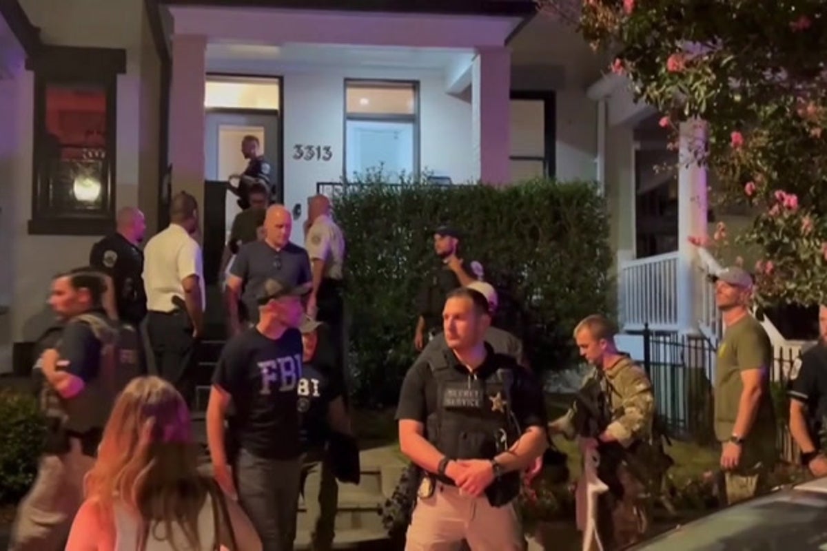 Protesters confront federal agents in D.C. after National Guard troops seen armed with guns