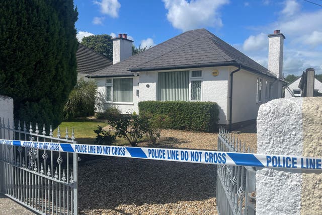 The scene at Slievenabrock Avenue, Newcastle, Co. Down, where 84-year-old Sean Small was found murdered on Sunday (Jonathan McCambridge/PA)