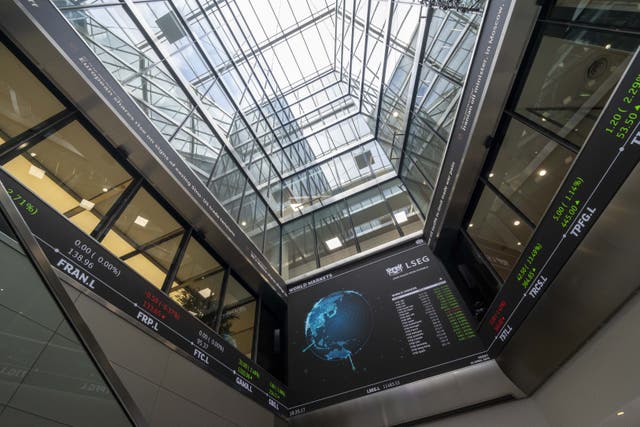The FTSE 100 index closed down 55.60 points at 9,265.80 (Jeff Moore/PA)