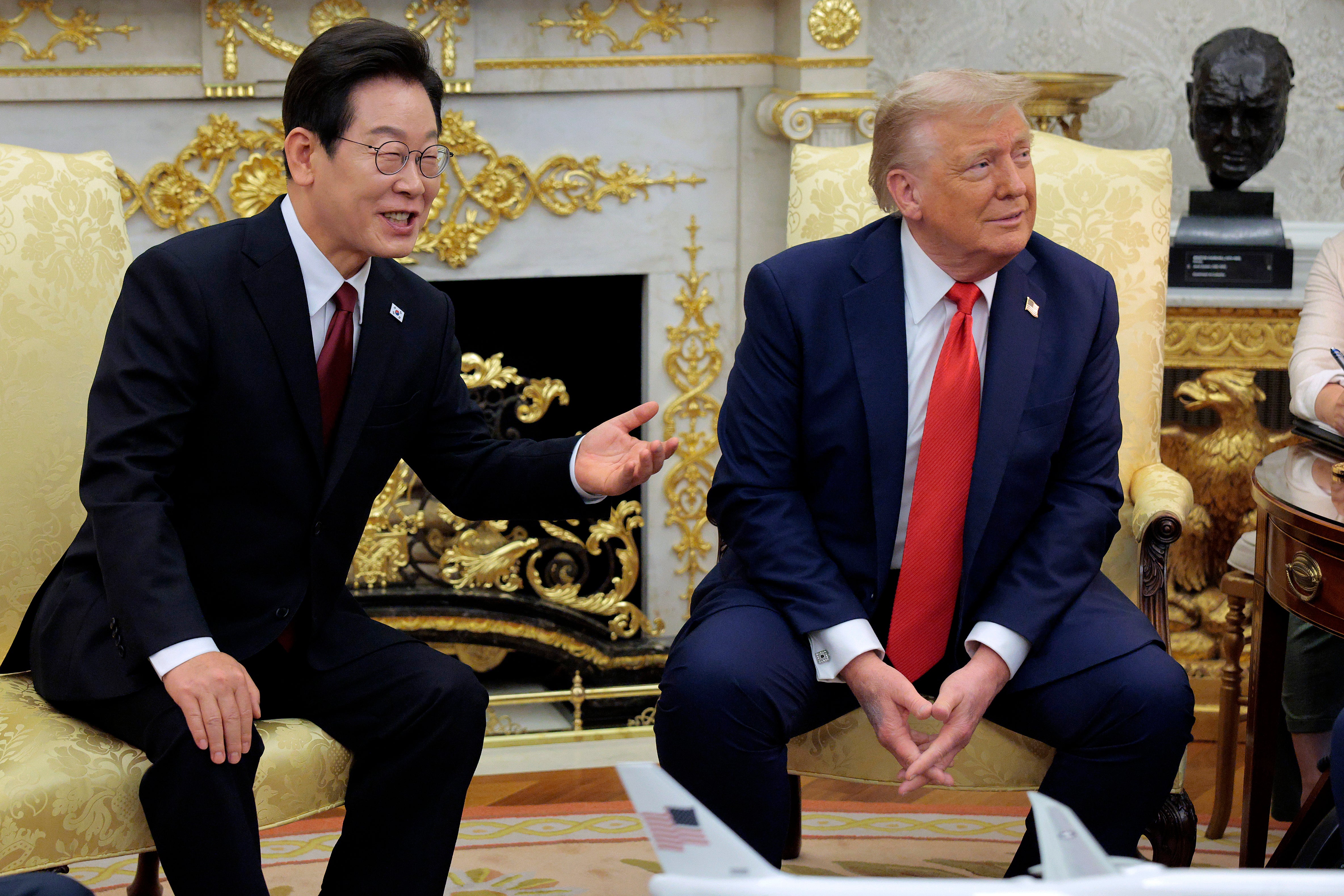 Lee Jae Myung and Donald Trump speak with reporters before an Oval Office meeting at the White House on 25 August 2025