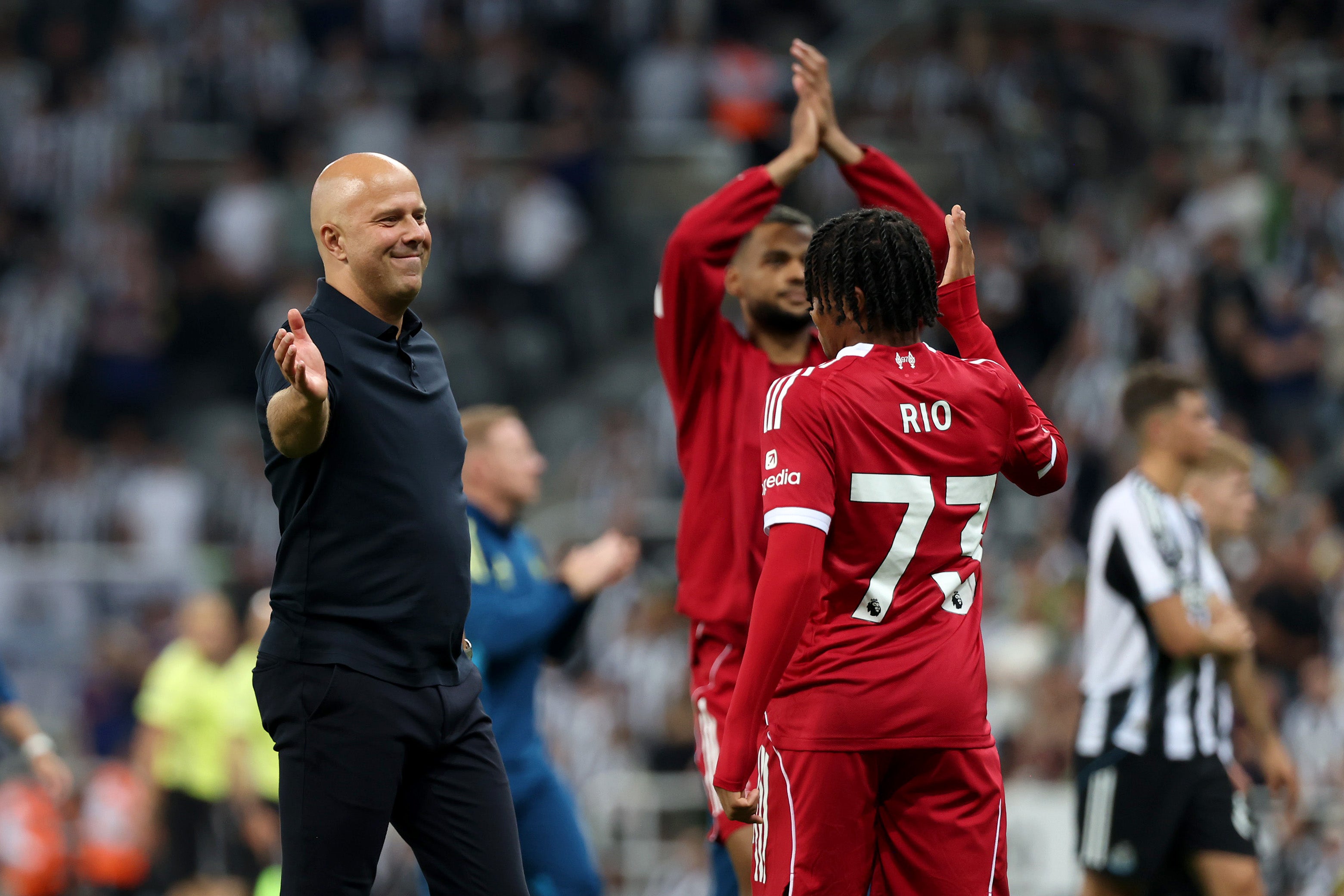 Liverpool head coach Arne Slot celebrates with match-winner Rio Ngumoha