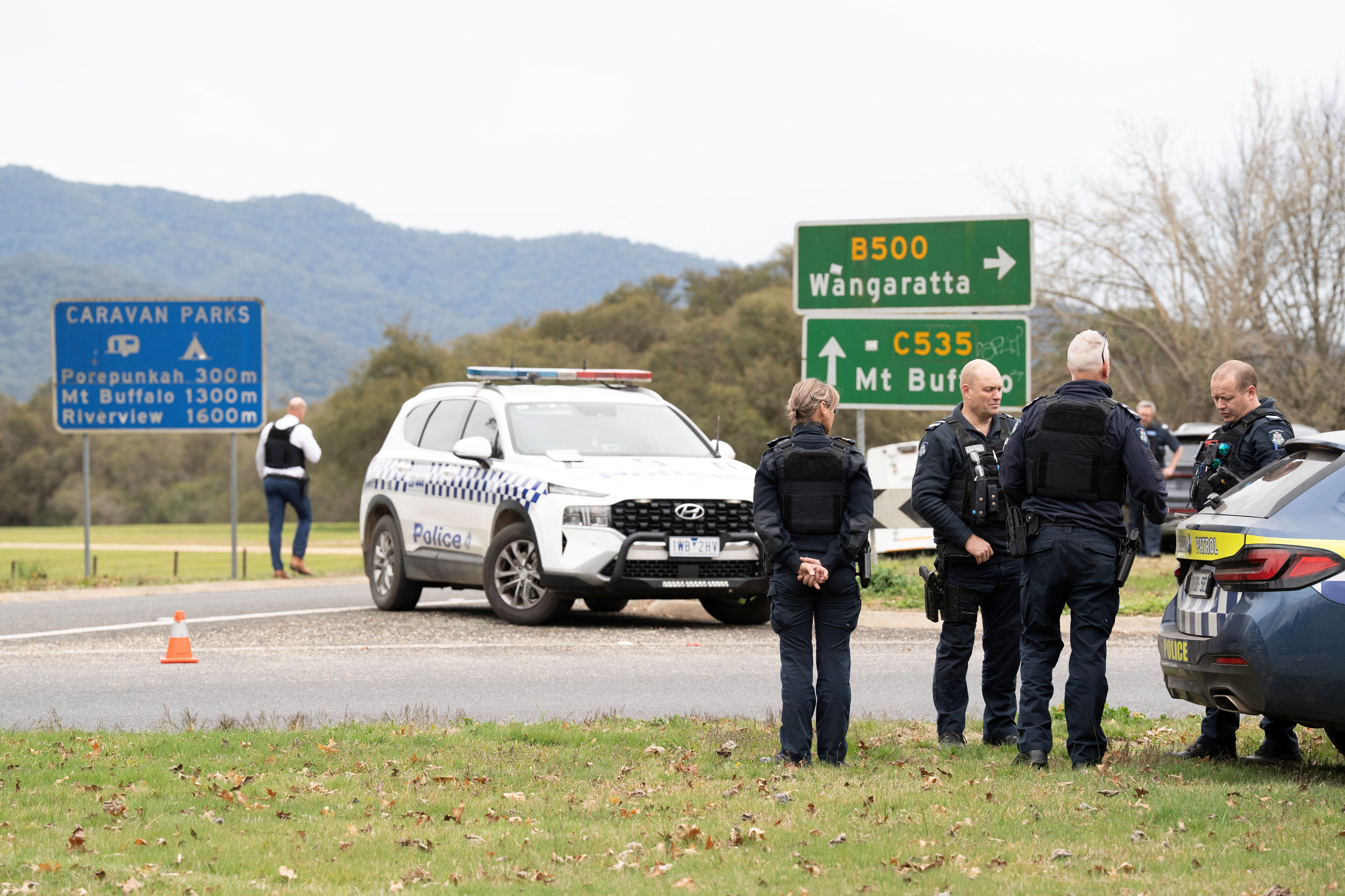 Victorian Police stand at the scene of a shooting in Porepunkah, Victoria, Australia, 26 August 2025
