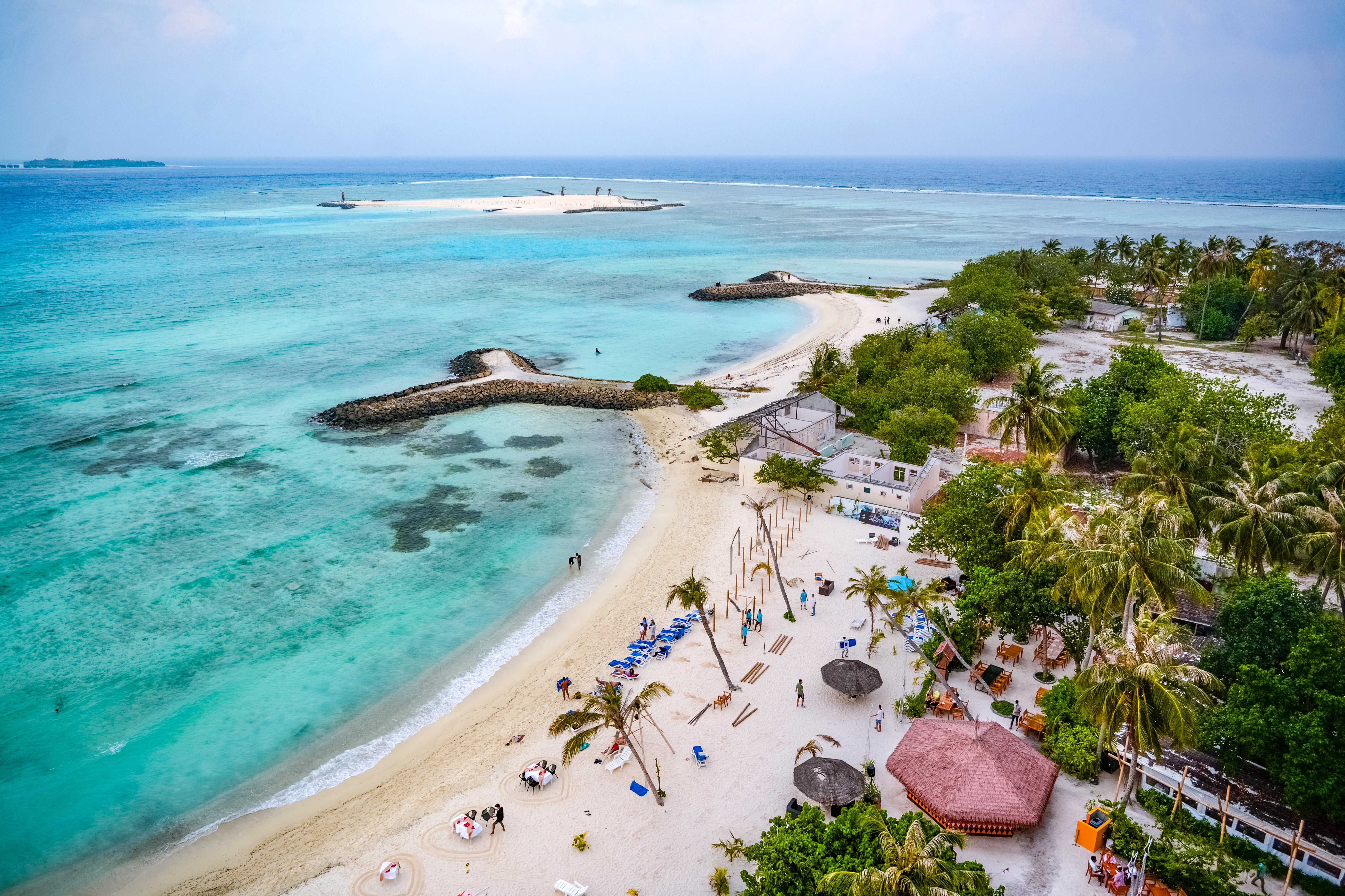 Tourists visit a beach at Maafushi island in the Maldives, a luxury holiday destination and top diving spot in the Indian Ocean