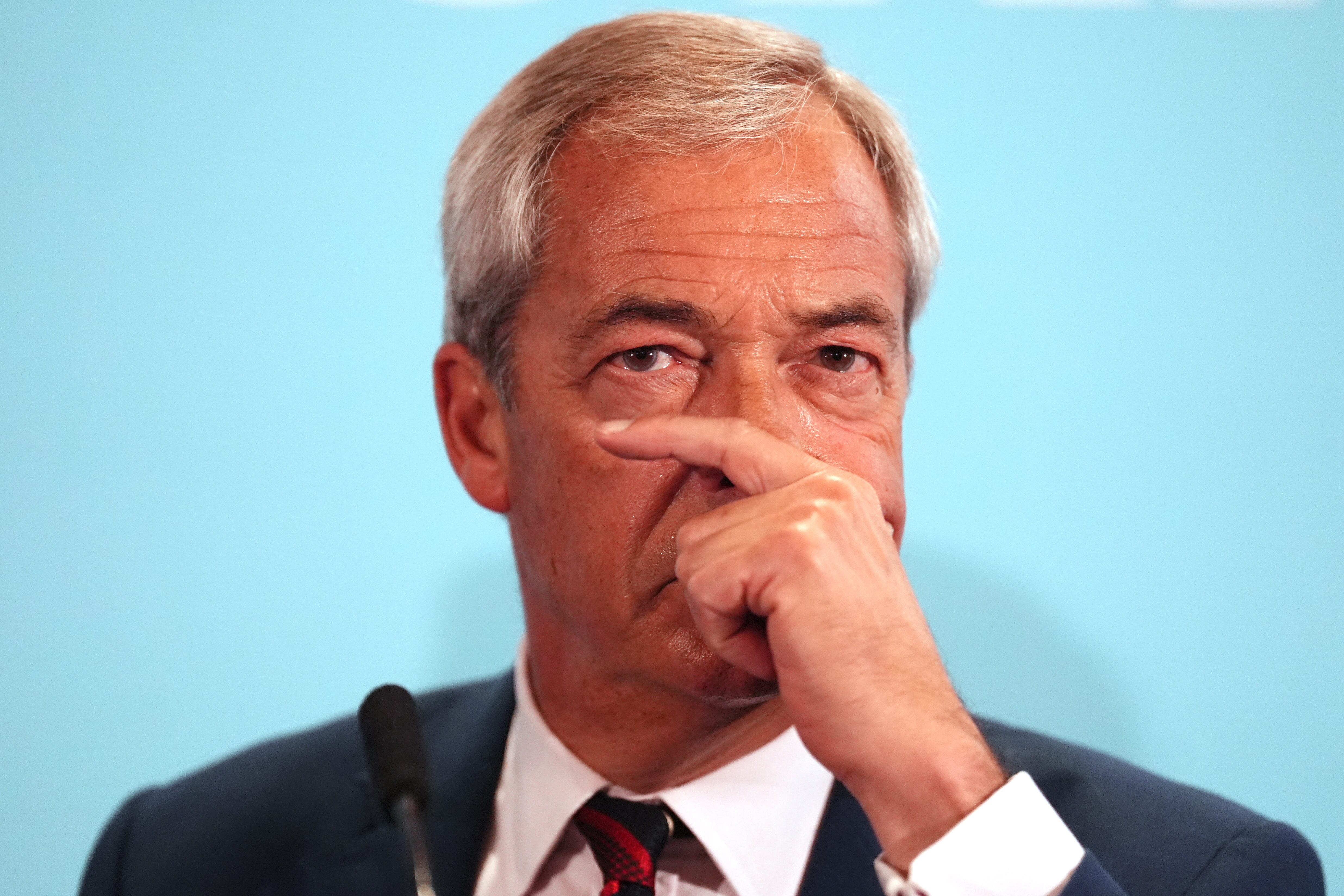 Nigel Farage said single women would be removed under his plans for ‘mass deportations’, but suggested women with children might not (Andrew Milligan/PA)