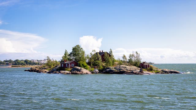 <p>Finland’s archipelago islands are home to red-painted wooden summer cabins</p>