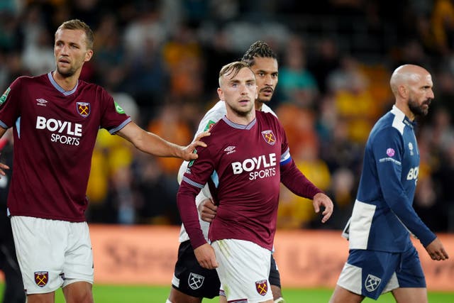 <p>Bowen is pulled away by team-mates after confronting a fan</p>