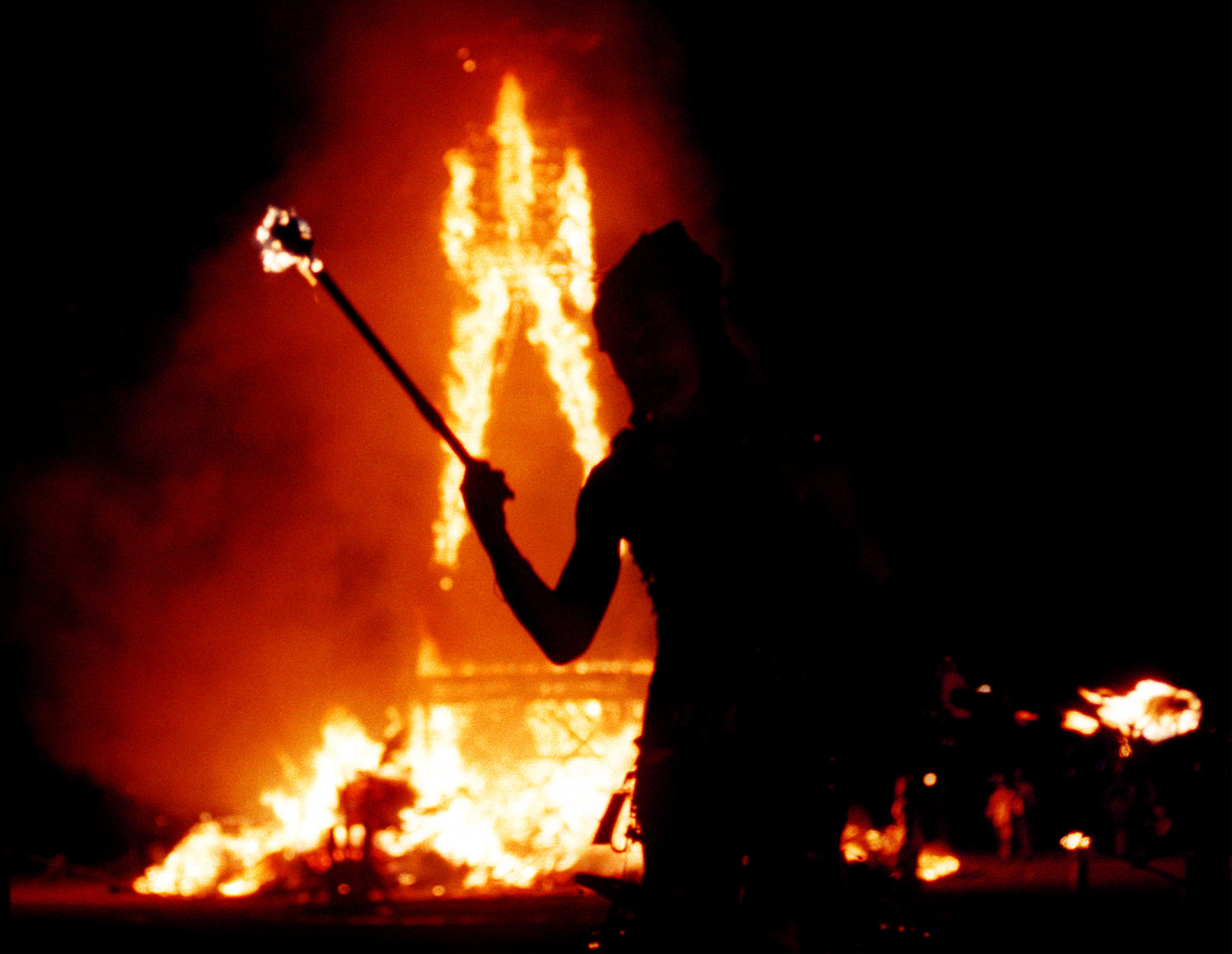 A fire juggler at the Burning Man festival in Nevada. Kayla Thompson was at the annual desert party on Wednesday when she unexpectedly gave birth to a baby girl in the bathroom of her RV
