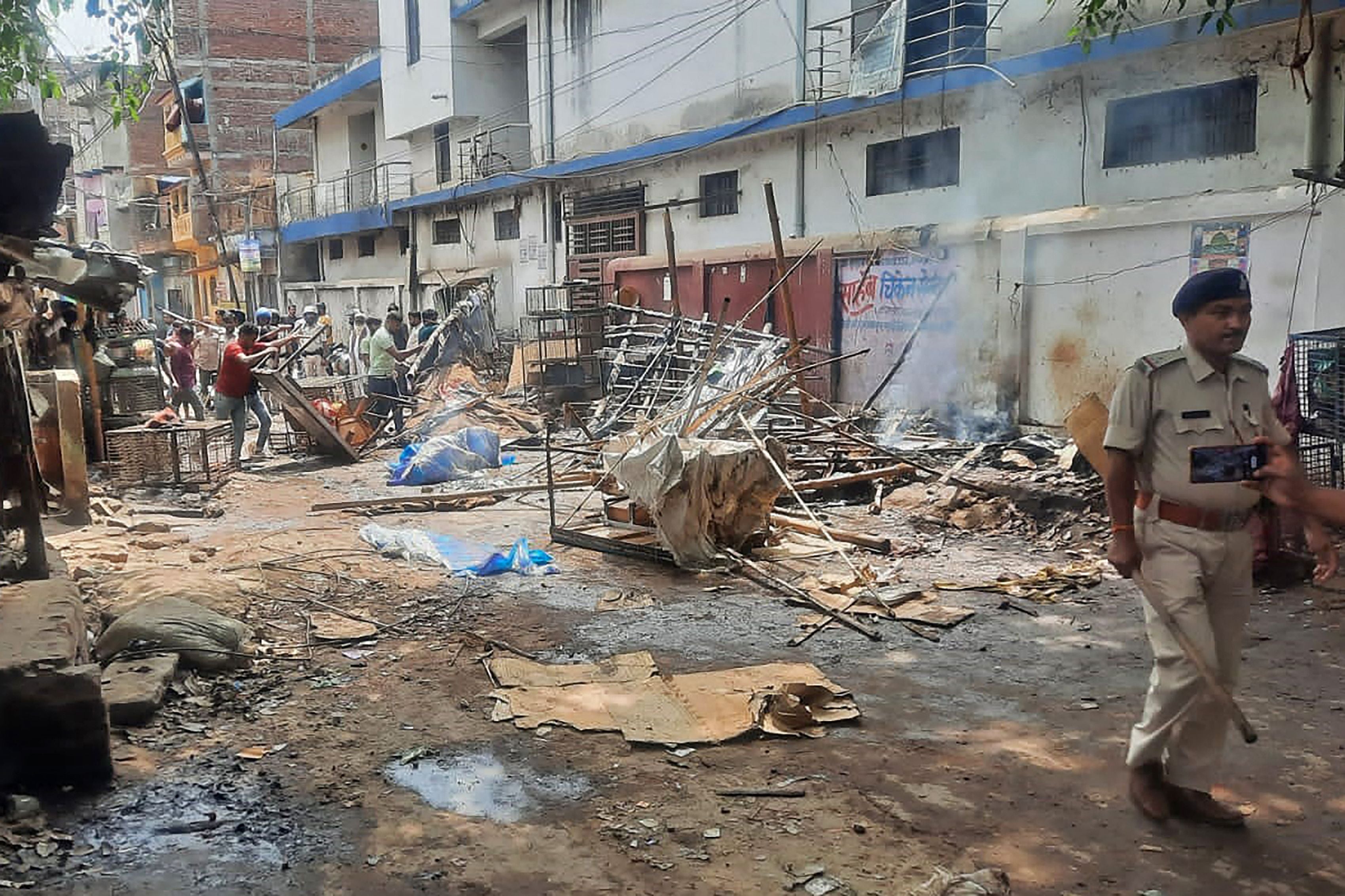 File. A policeman walks through a street after a violent clash at Sasaram in Bihar, India