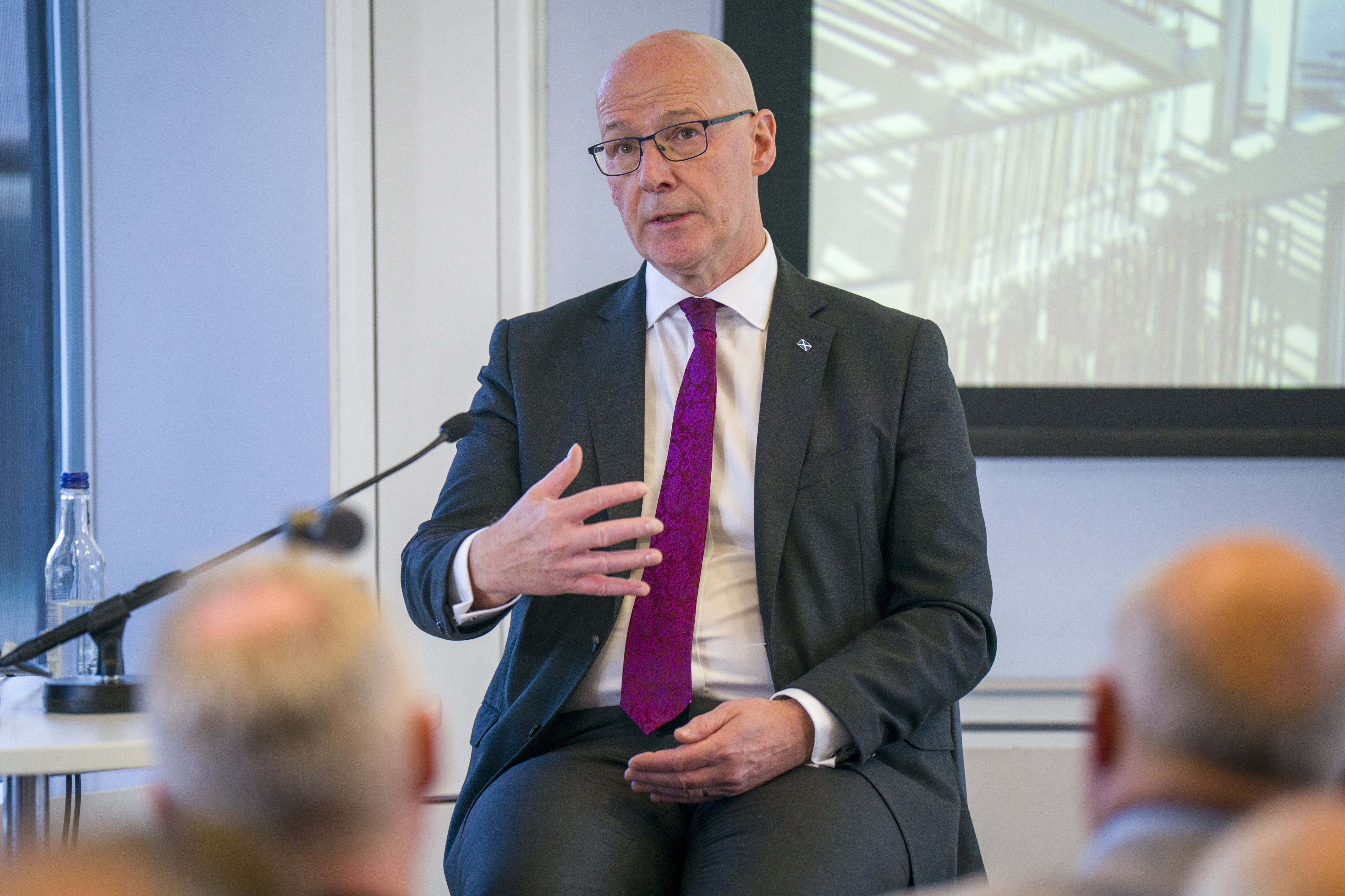 John Swinney said Graham Simpson should stand down from Holyrood after defecting from the Tories to Reform (Jane Barlow/PA)