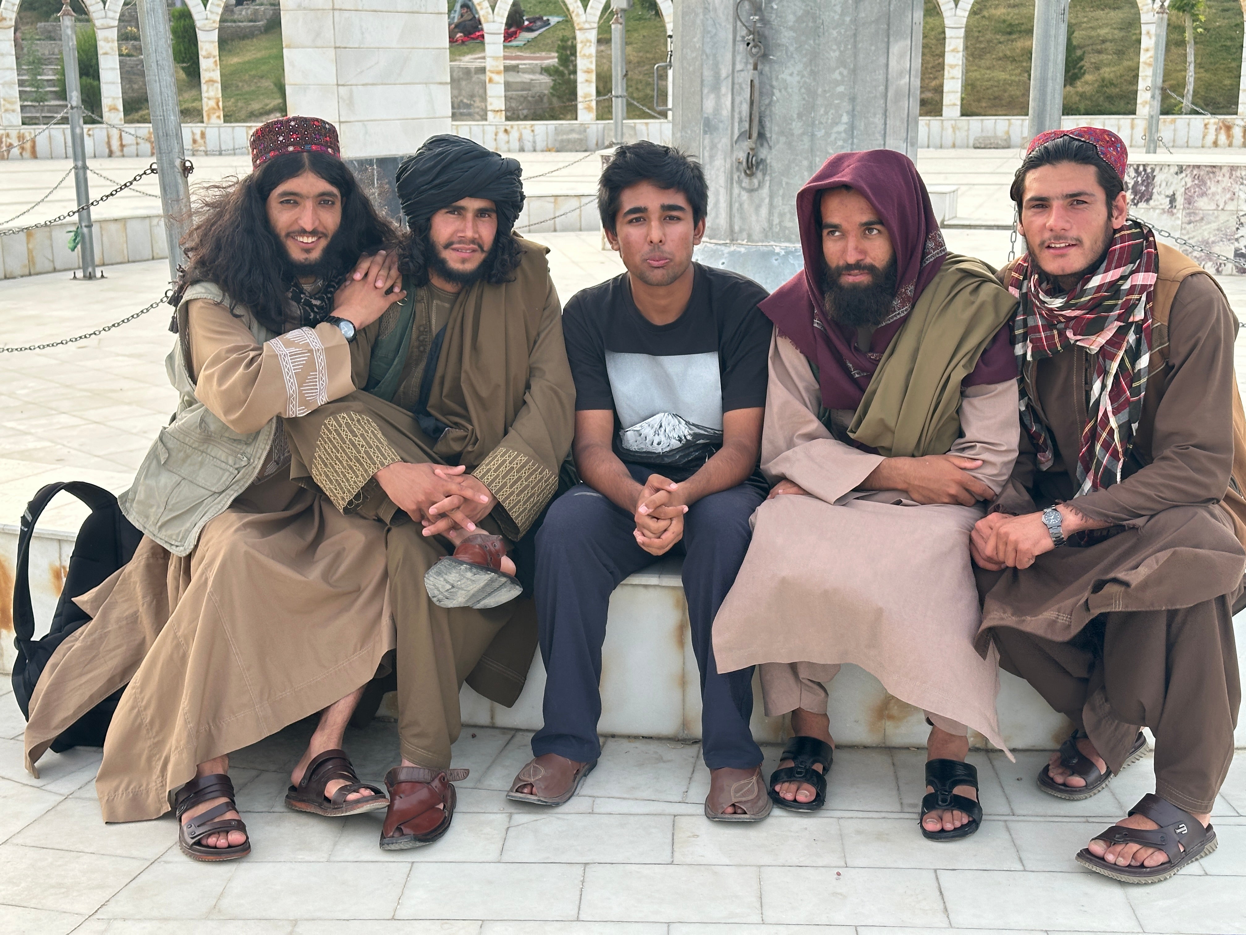 <p>Teen globetrotter Arjun Malaviya with members of the Taliban in Afghanistan. He revealed that being a member of the group is seen as a regular job by many locals, who 'don't have crazy views.’</p>