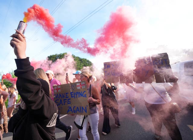 <p>People protesting near the Bell Hotel in Epping, Essex (Yui Mok/PA)</p>