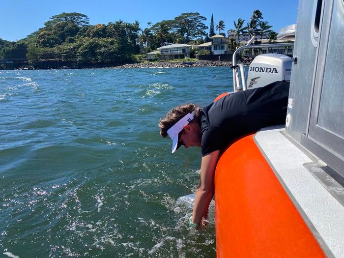 Arizona State University associate research scientists Kelly Hondula gathers water samples around west Hawaii Island. Hondula and researchers have pinpointed locations that are specifically at risk from sewage contamination