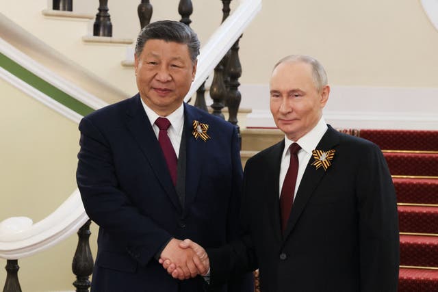 <p>Russia's president Vladimir Putin greets Chinese president Xi Jinping prior to the Victory Day military parade in Moscow on 9 May 2025</p>