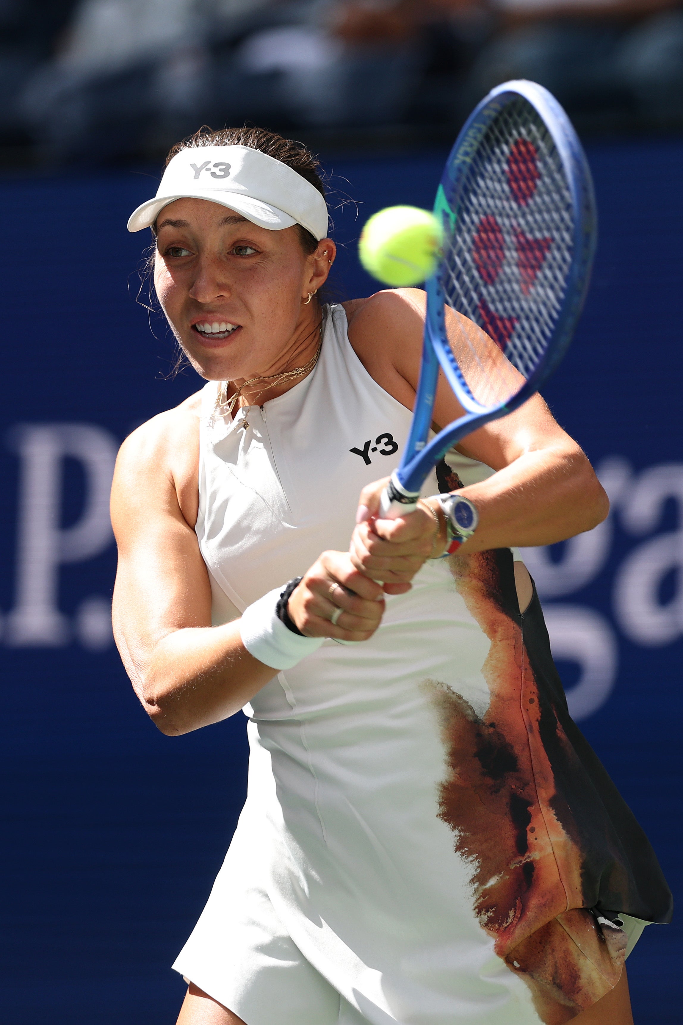 Jessica Pegula opted for a simple white dress with a matching visor and wristbands for her August 24 match. However, a black-and-brown print on the side of her dress appeared oddly placed, slightly disrupting the otherwise clean look