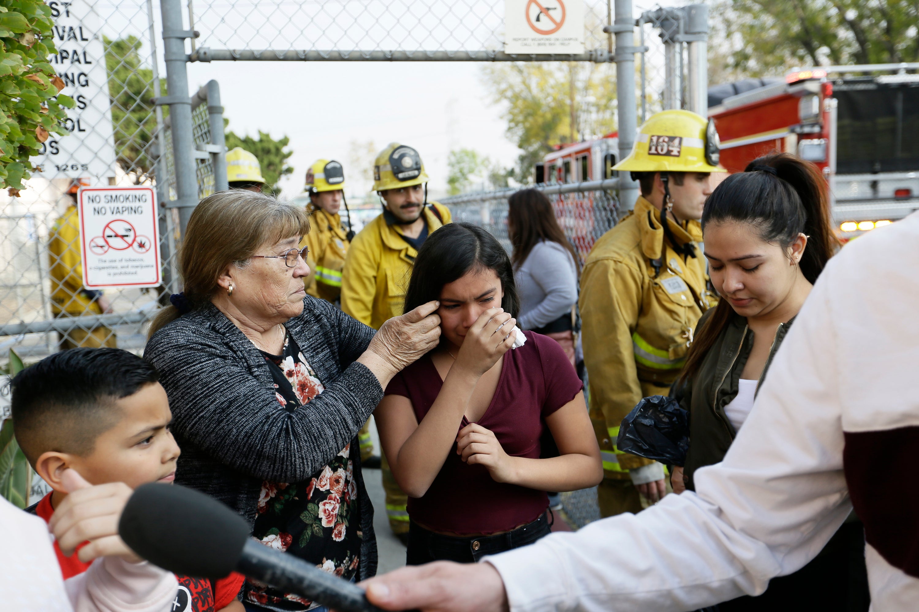 A student cries as she evacuates Park Avenue Elementary School after jet fuel fell on the school in Cudahy, Calif., Jan. 14, 2020