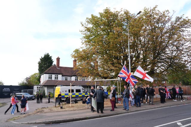 Police and protesters outside the Bell Hotel after a temporary injunction that would have blocked asylum seekers from being housed at the hotel in Epping, Essex, was overturned at the Court of Appeal (Jonathan Brady/PA)
