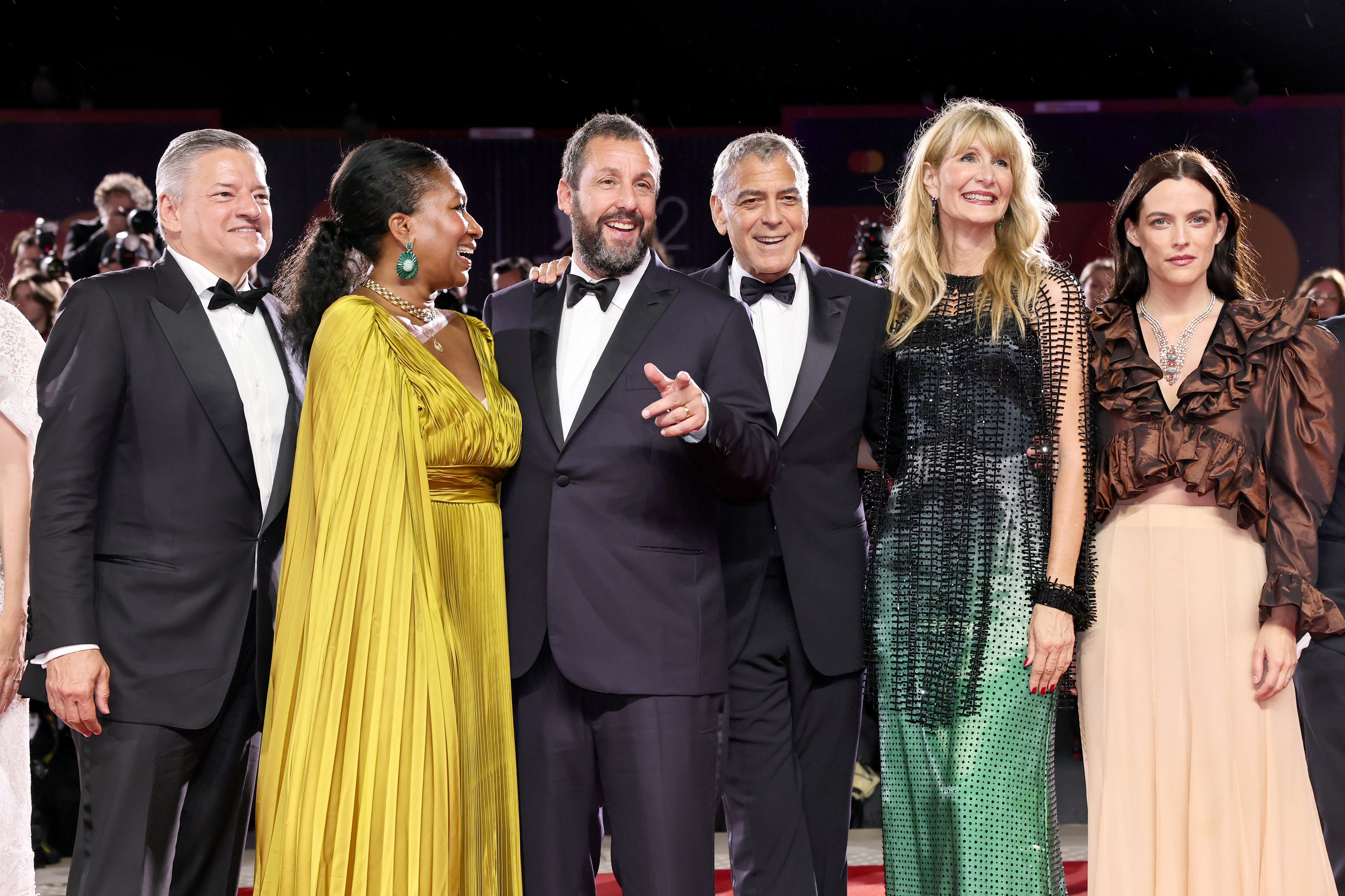 Ted Sarandos, Nicole Avant, Adam Sandler, George Clooney, Laura Dern and Riley Keough attend the 'Jay Kelly' red carpet during the 82nd Venice International Film Festival