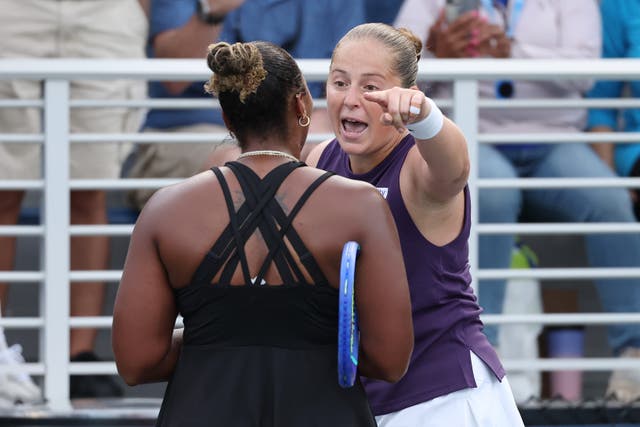 <p>Jelena Ostapenko of Latvia argues with Taylor Townsend of the United States</p>