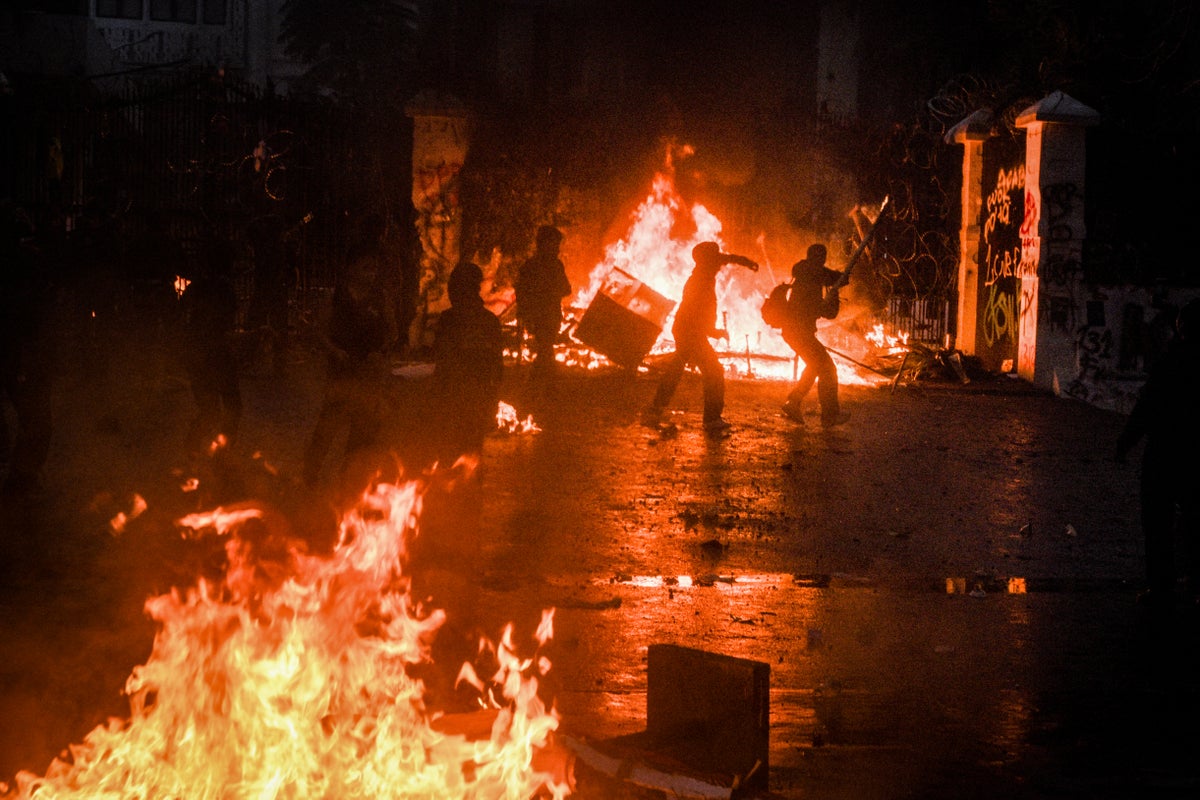 Protests rage in Indonesia as mob sets fire to regional parliament building