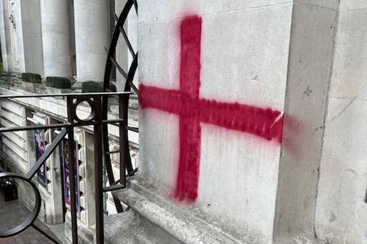 Vandals graffiti St George's Cross on historic building