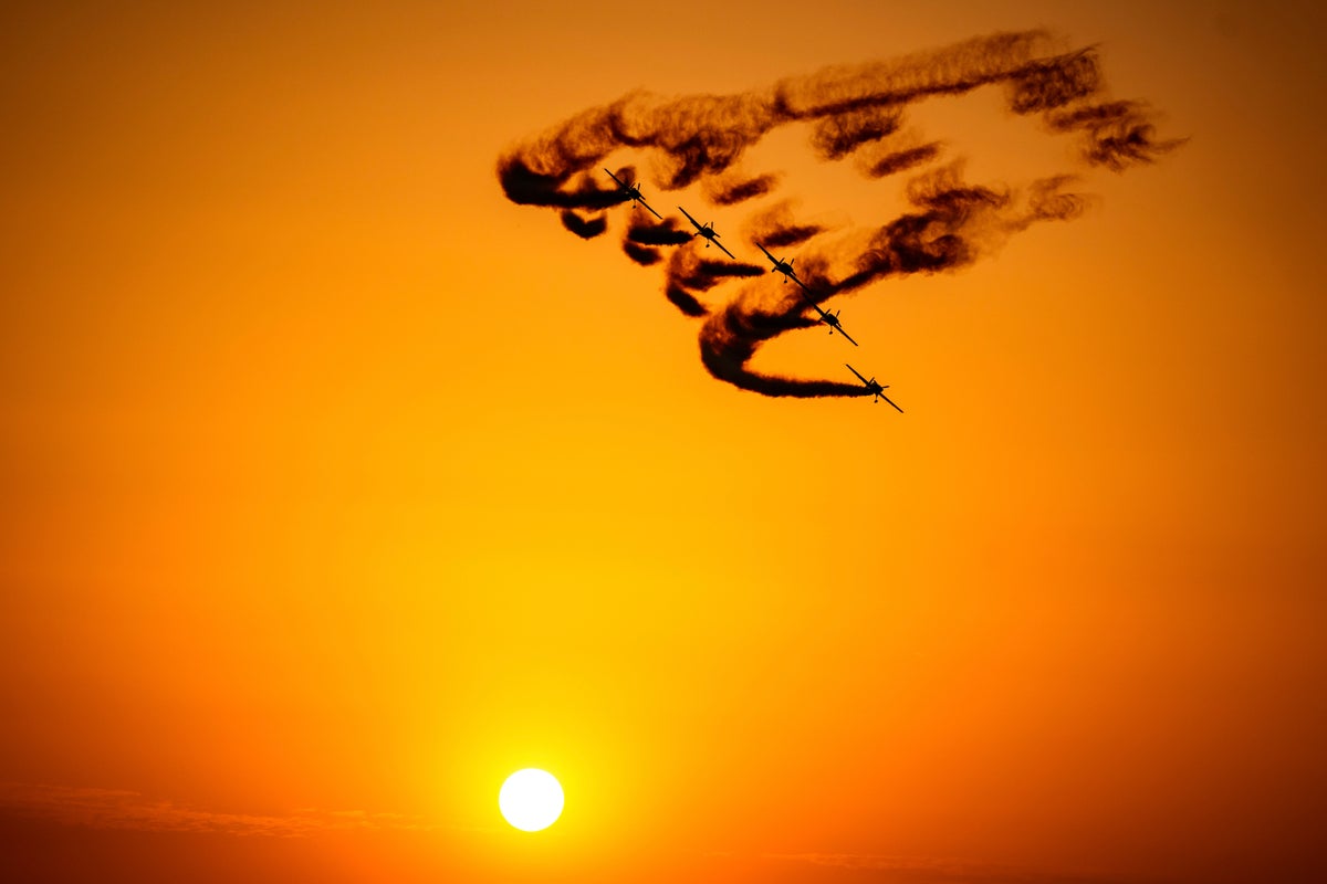 Photos of a display of aerobatics and military air power at the Bucharest International Air Show