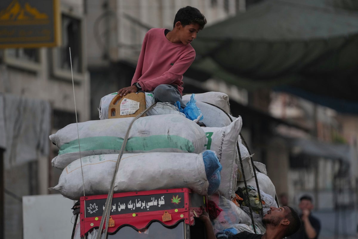 Photos show displaced Palestinians fleeing the northern Gaza Strip