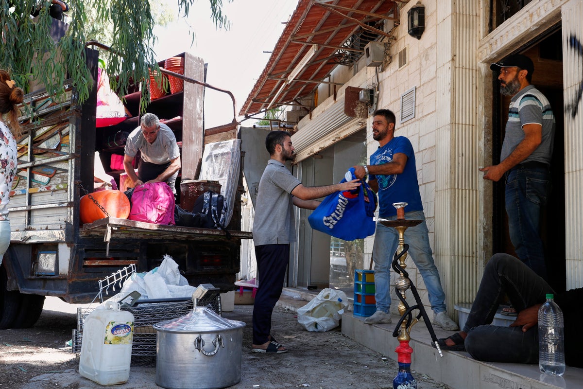 Alawite families flee Damascus suburb after violence and eviction threats